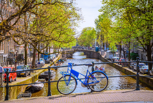 Bikes on the bridge in Amsterdam, Netherlands. Canals of Amsterdam.