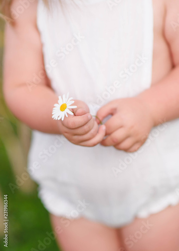 portrait of little girl outdoors in summer