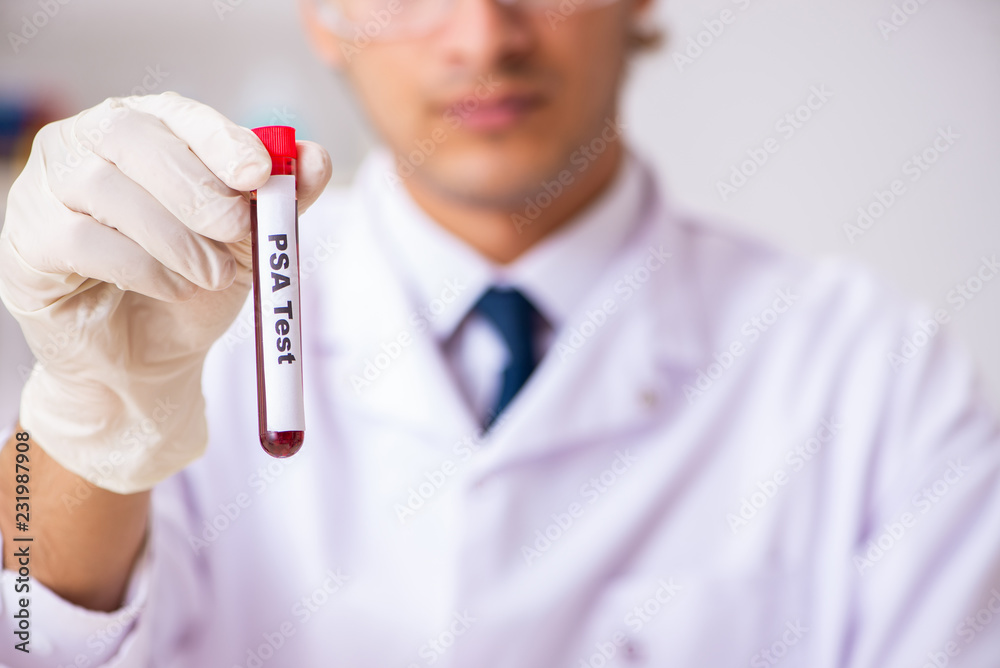 Young handsome lab assistant testing blood samples in hospital Young handsome lab assistant testing blood samples in hospital