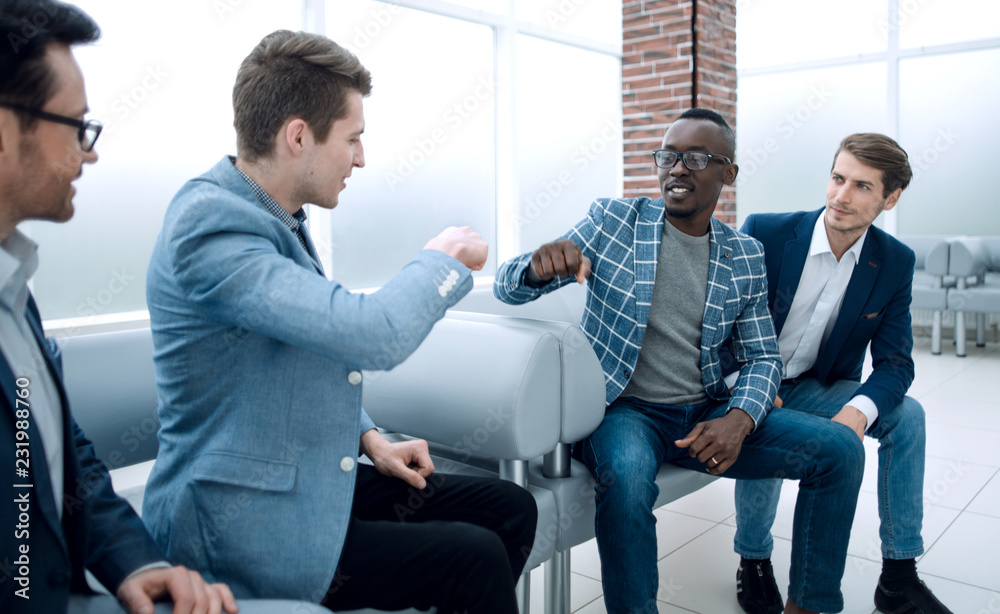 business colleagues showing their success with a gesture of fists business colleagues showing their success with a gesture of fists