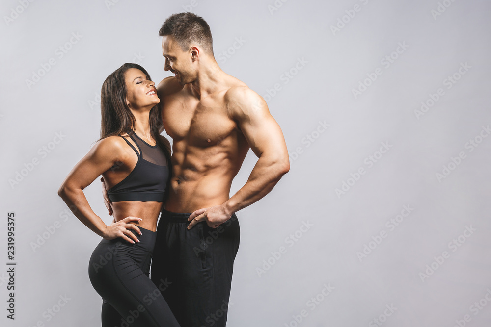 Athletic man and woman isolated over white background. Personal fitness instructor. Personal training. - obrazy, fototapety, plakaty 