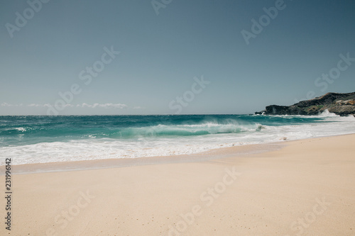 Sandy beach in Oahu at a sunny day