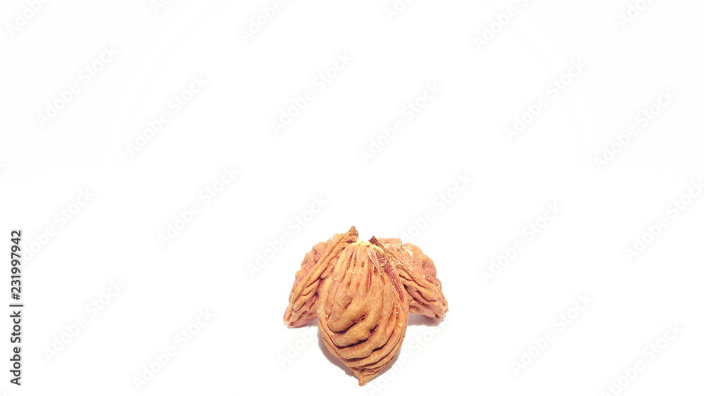 Obraz premium Fruit Pits on White Background. Nectarine Peach Seeds. Art and Craft.