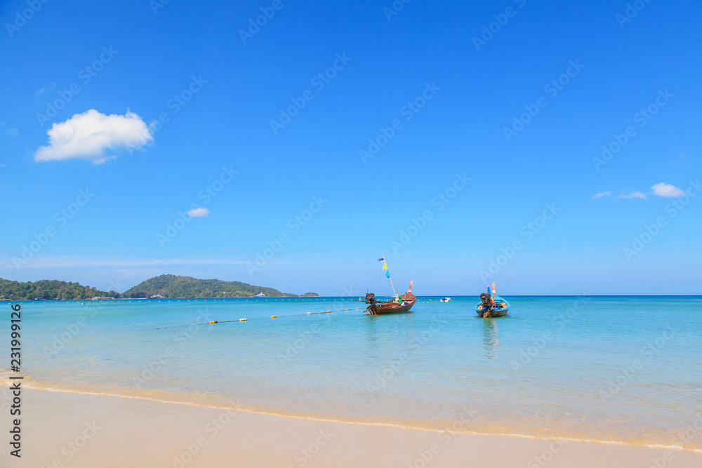 Long tail boats at the beautiful beach in Phuket, Thailand