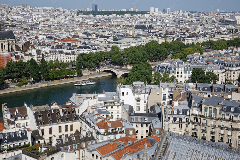Paris, France - May 6, 2018: View of Paris skyline, Seine river and bridges seen from the top of Notre Dame cathedral