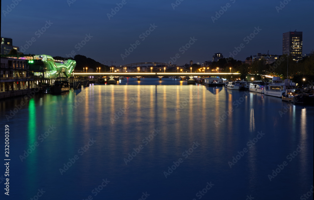 Paris, France - October 31, 2017: Cite de la Mode et du Design, The City of Fashion and Design, on the banks of the Seine River. Colourful original green building