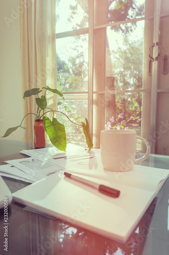 Open laptop and accessories with coffee cup for home workplace