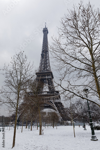 Paris, France - February 7, 2018: Eiffel tower and champs de mars covered with snow