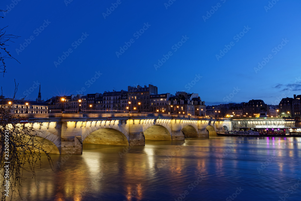 Fototapeta premium Paris, France - February 18, 2018: View of Pont Neuf, old bridge in Paris by night