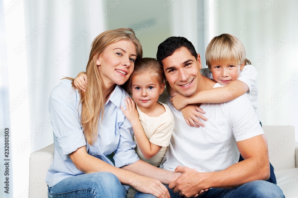 Young family at home smiling at camera Young family at home smiling at camera