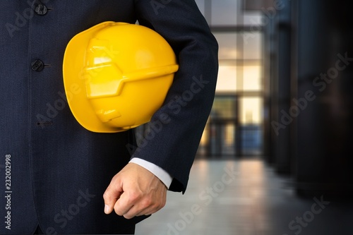 Worker man with helmet on background photo