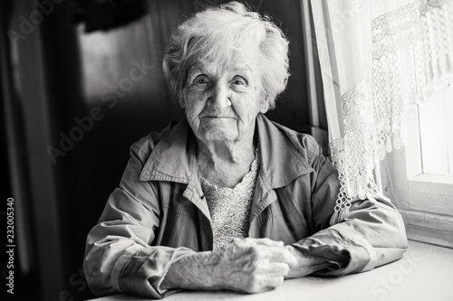 Monochrome portrait of an elderly woman.