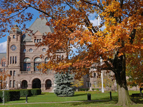 Queen's Park, Toronto and provincial parliament building with colorful oak tree in fall