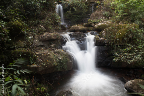 Water of the stream in the natural, Beautiful waterfall in forest.