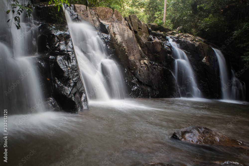 Fototapeta premium Water of the stream in the natural, Beautiful waterfall in forest.