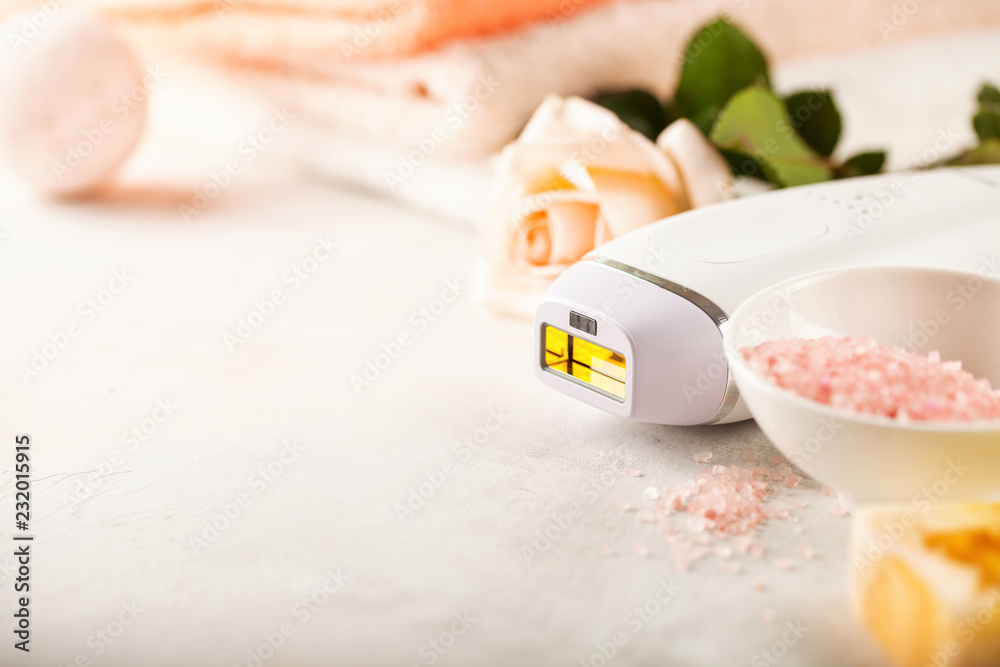 Modern photoepilator with bath accessories Modern photoepilator with bath accessories