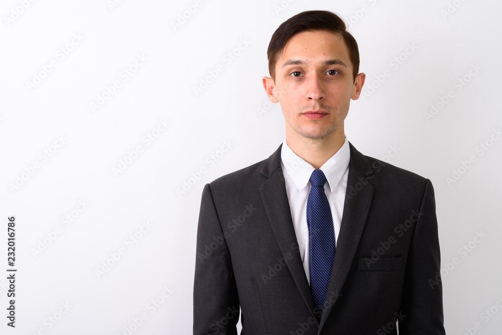 Portrait of young handsome businessman against white background Portrait of young handsome businessman against white background
