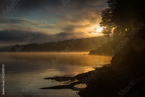 Morning view on foggy Shaori Lake at sunrise Georgia country