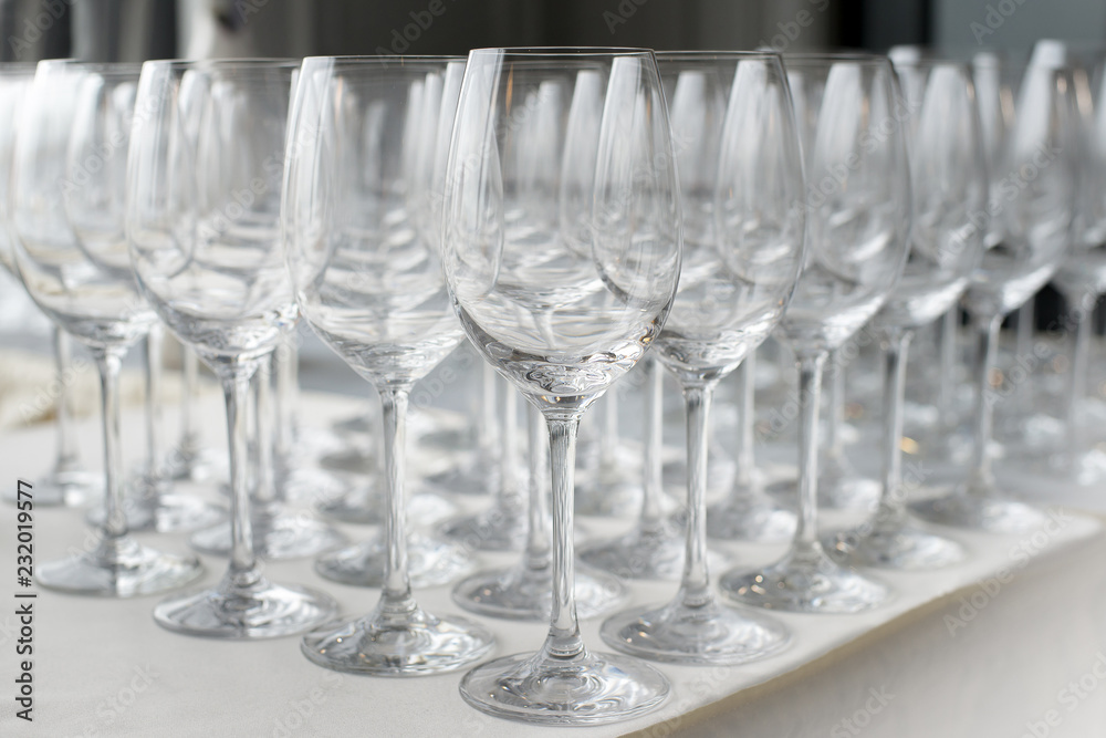 A lot of wine glasses in a row A lot of wine glasses in a row