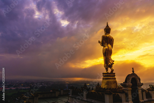 Great Golden Buddha statue at the Wat Phra That Kao Noi    Nan province  Thailand  with sky  Twilight time