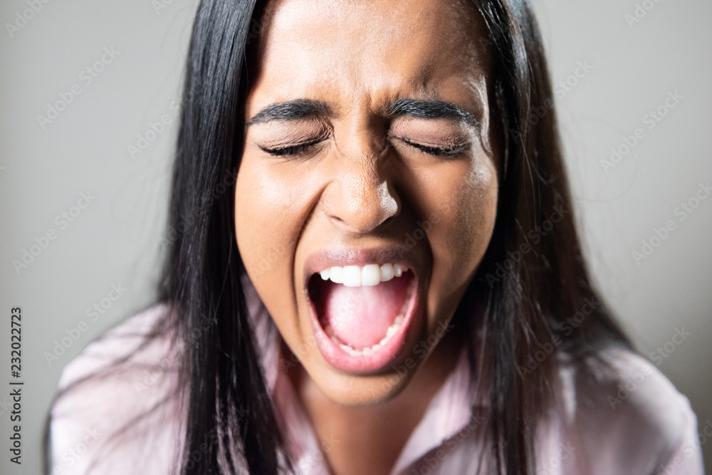 Close up of Woman of Color screaming Close up of Woman of Color screaming