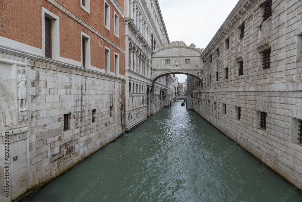 VENICE, ITALY- OCTOBER 30, 2018: The Bridge of Sighs. The enclosed bridge passes over the Rio di Palazzo, and connects the New Prison  to the interrogation rooms in the Doge's Palace.