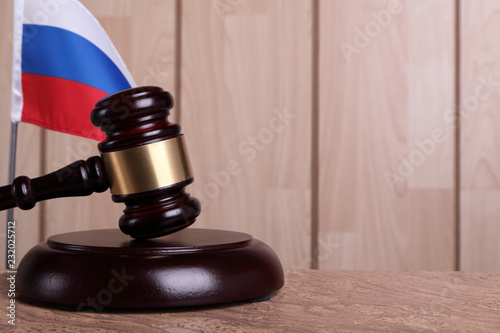 Flag of Russia and a gavel on a sounding block photo