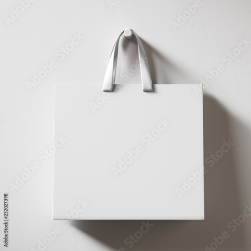 Hanging white shopping bag isolated on bright background. 3d rendering mock up photo