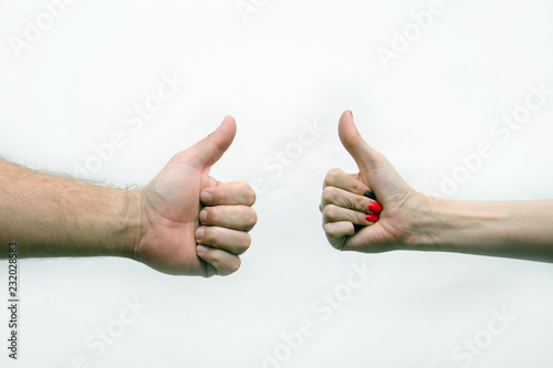 two hands with a gesture finger up on a light background