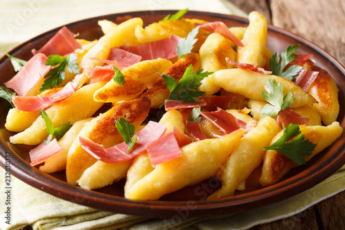 Schupfnudeln, also called Fingernudel (finger noodle), is a type of dumpling or thick noodle in southern German and Austrian cuisine close-up. horizontal photo