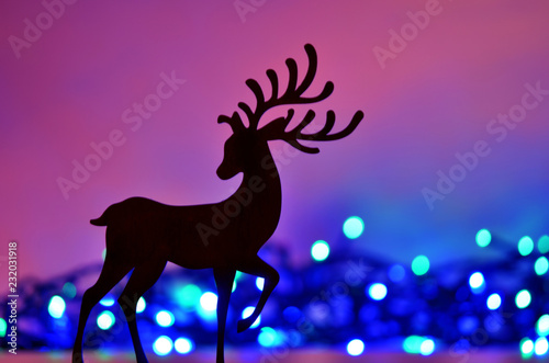 Christmas background with deer silhouette.
