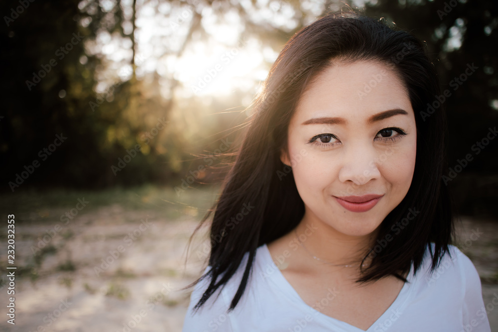 Beautiful woman walk outdoor along with sand and pine under warm sunlight. Beautiful woman walk outdoor along with sand and pine under warm sunlight.