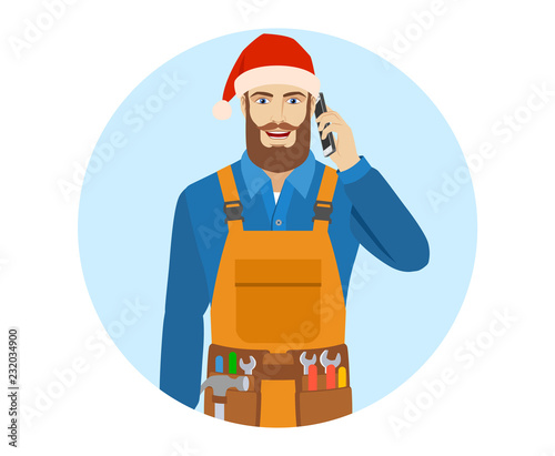 Worker in Santa hat talking on the mobile phone.