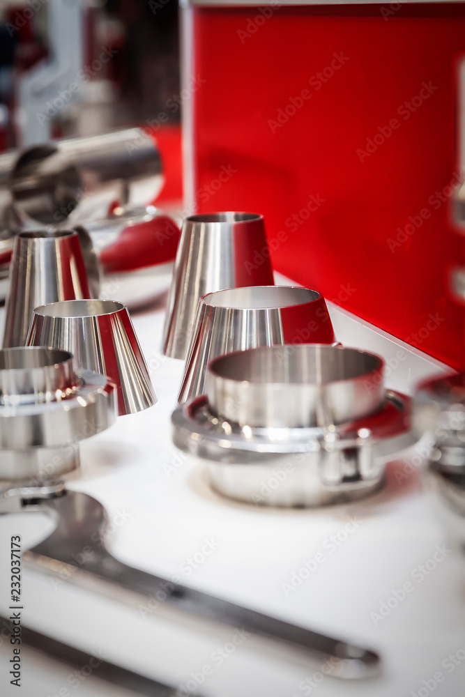 Various conical pipe fittings and tools, stainless steel, selective focus Various conical pipe fittings and tools, stainless steel, selective focus