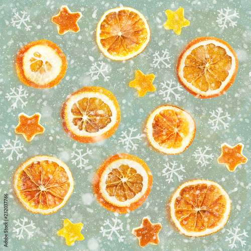 Christmas background of dried oranges, orange peel in the shape of a star. Seamless background