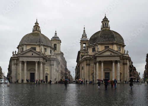 Two medieval churches in Piazza Popolo in Rome in the rain. © Наталья Иванова