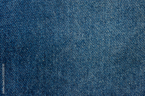 Texture of blue denim without seams and buttons close-up shot.