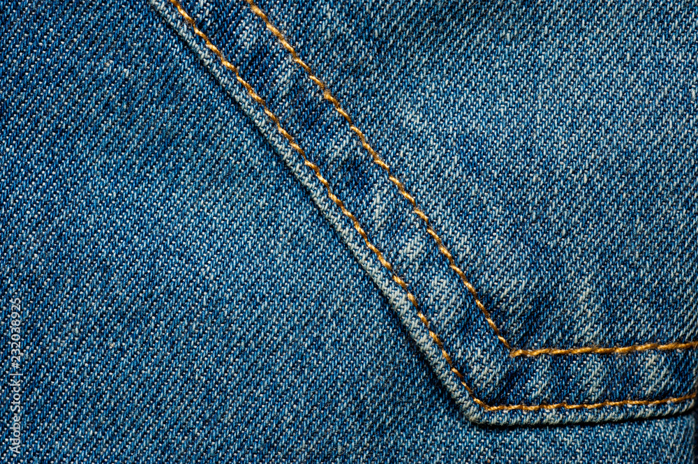 Textured blue denim texture stitched with a button-up texture Textured blue denim texture stitched with a button-up texture