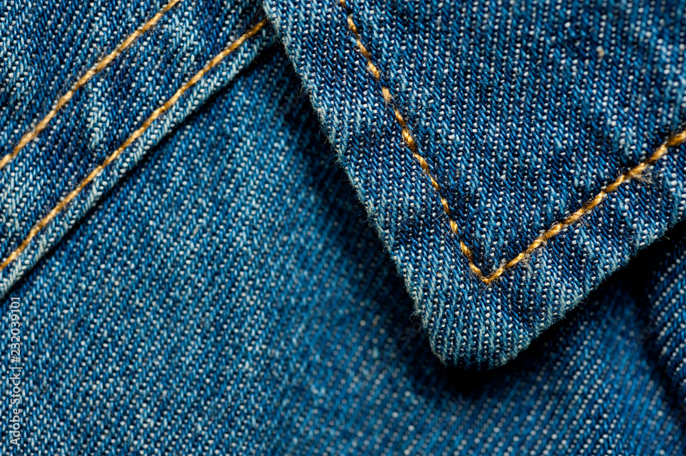 Textured blue denim texture stitched with a button-up texture Textured blue denim texture stitched with a button-up texture