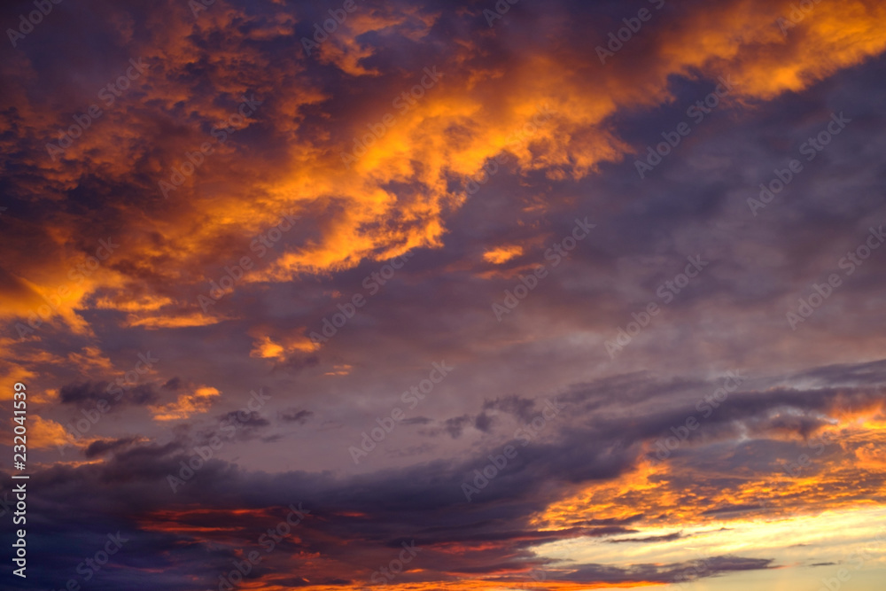 reddish red sunset sky with clouds and clouds