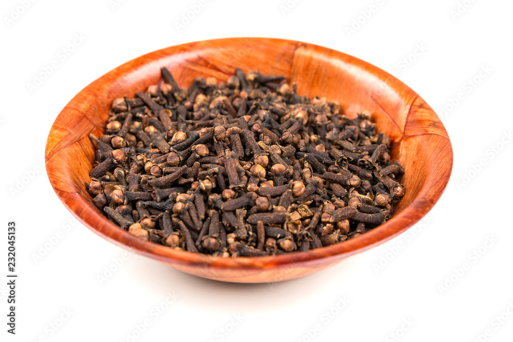 Whole clove heads and pieces isolated over white Whole clove heads and pieces isolated over white