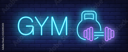 Gym neon sign. Glowing inscription with kettle bell and barbell on dark blue brick background. Vector illustration can be used for fitness clubs, sports, trainings