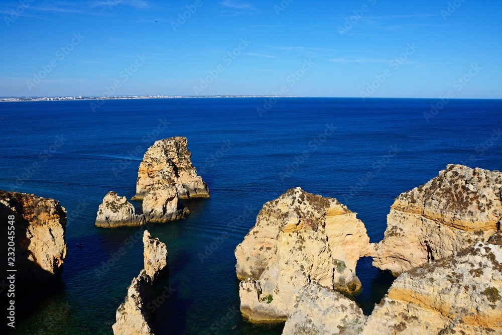 Elevated view of the cliffs with views over the ocean towards the coastline, Ponta da Piedade, Lagos, Portugal.