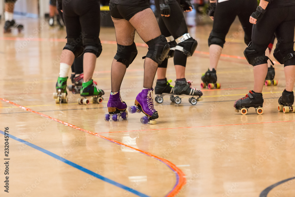 Roller derby players compete against each other Roller derby players compete against each other