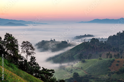 Mountain and foggy at morning time with orange sky, beautiful landscape
