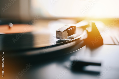 Turntable needle playing vinyl record