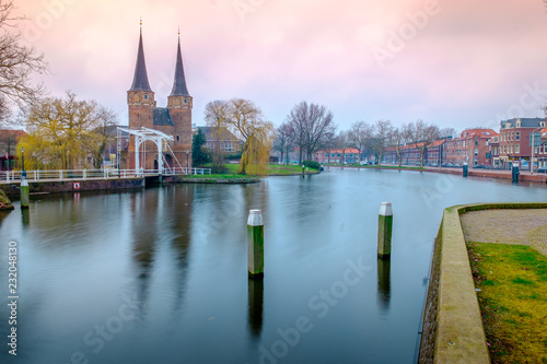 Evening view of the canal and the VVE Oostpoort de Delft. Dutch city in the spring after sunset. Holland  Netherlands.