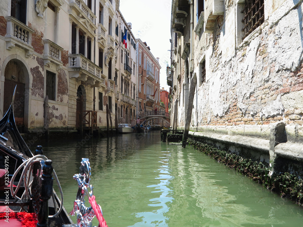 20.06.2017, Venice, Italy: View from gondola to historic buildings and canals