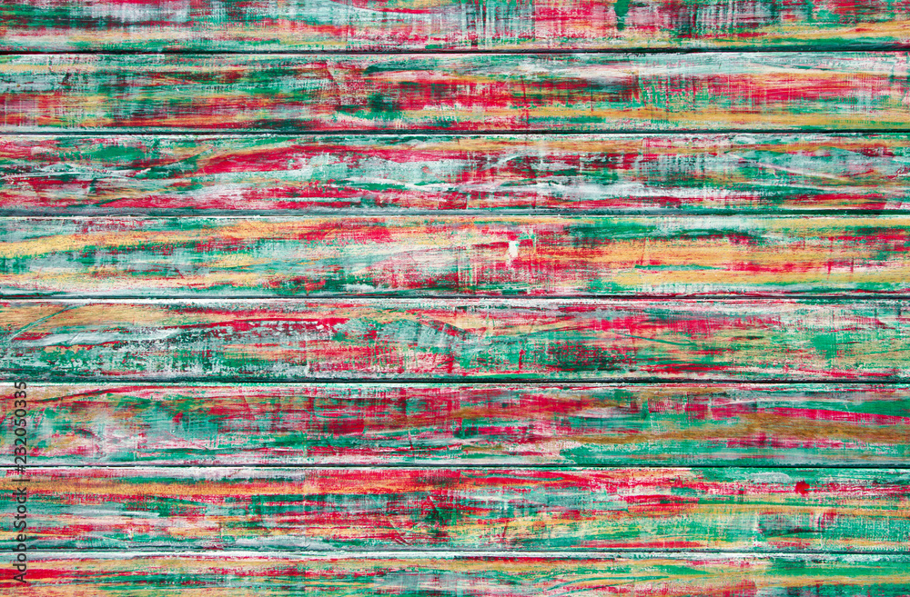 old tree painted in red yellow green color