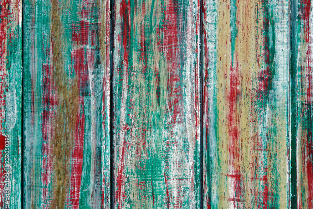 old tree painted in red yellow green color old tree painted in red yellow green color